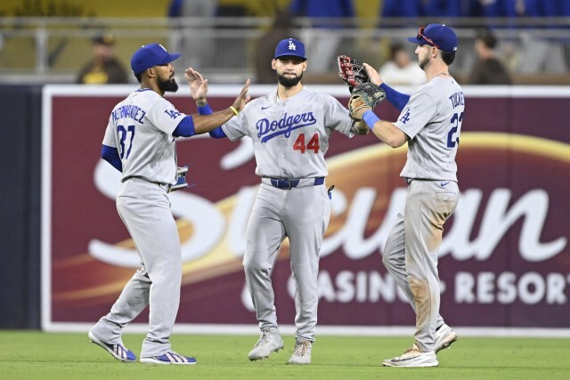 Dodgers outfielders celebrate.