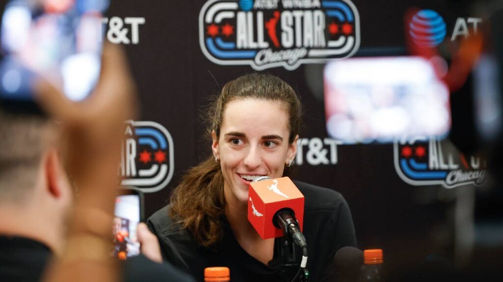 Barack Obama and Caitlin Clark moment at WNBA All-Star media day in Chicago, with cameras focused on Clark as she discusses Obama’s advice about handling fame and joy.