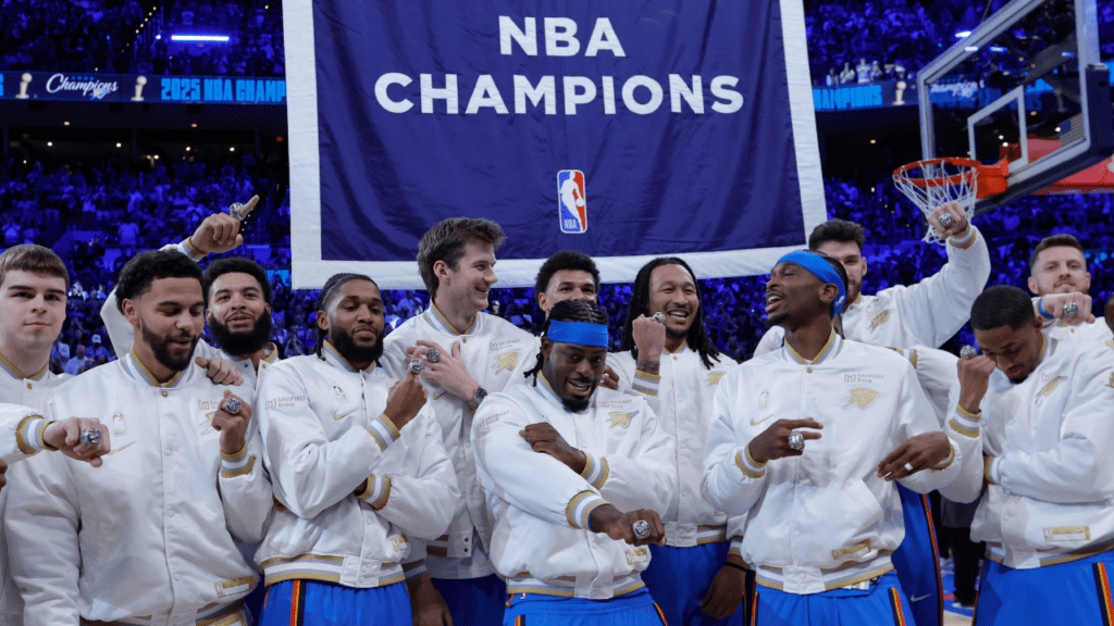 Oct 21, 2025; Oklahoma City, Oklahoma, USA; Oklahoma City Thunder stands in front of their championship banner during a ceremony before the start of a game against the Houston Rockets at Paycom Center. Mandatory Credit: Alonzo Adams-Imagn Images