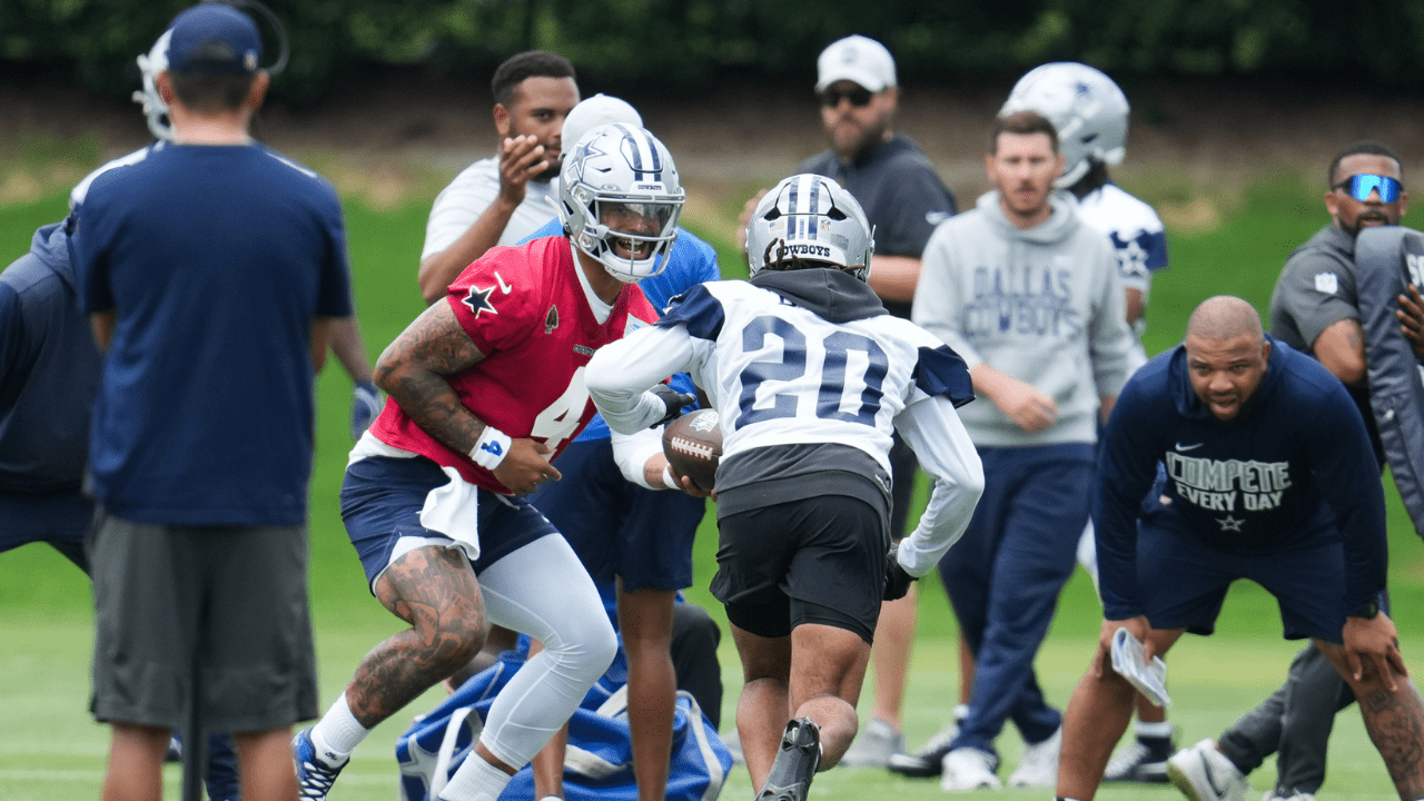Jun 16, 2026; Dallas, TX, USA; Dallas Cowboys quarterback Dak Prescott (4) and running back Malik Davis (20) go through a drill during practice at the Ford Center at the Star Training Facility in Frisco, Texas. Mandatory Credit: Chris Jones-Imagn Images