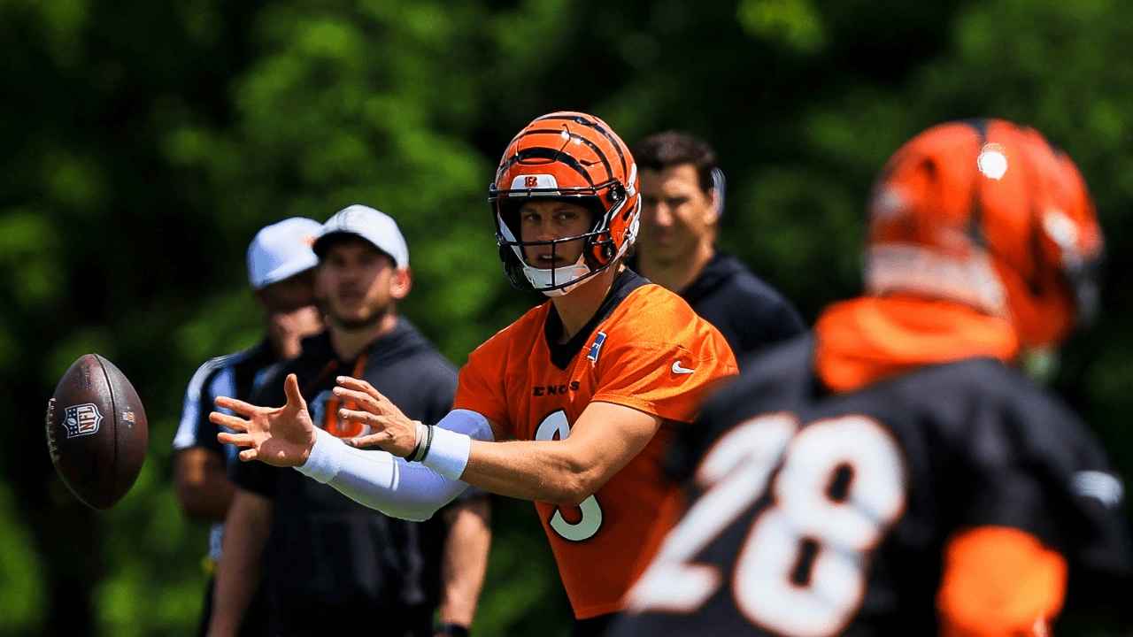 Jun 16, 2026; Cincinnati, OH, USA; Cincinnati Bengals quarterback Joe Burrow (9) snaps the ball during minicamp at Kettering Health Practice Fields. Mandatory Credit: Katie Stratman-Imagn Images