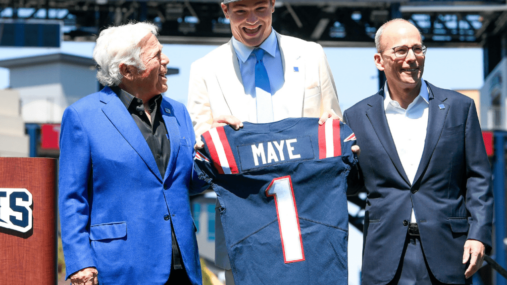 Apr 26, 2024; Foxborough, MA, USA; New England Patriots owner (L) Robert Kraft and president Jonathan Kraft (R) introduce the team's first round draft pick quarterback Drake Maye (C) on the game field at Gillette Stadium. Mandatory Credit: Eric Canha-USA TODAY Sports