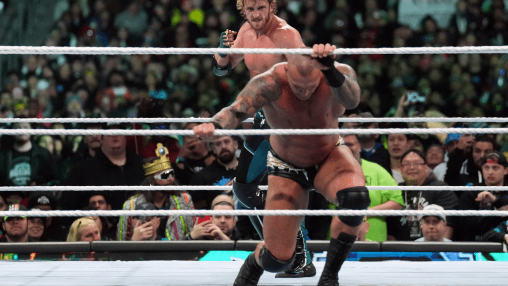 Logan Paul, Randy Orton, and Kevin Owens participate in a WWE match.