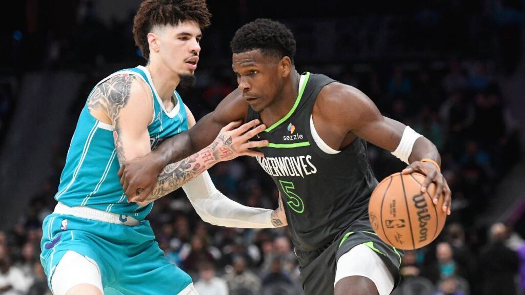 Minnesota Timberwolves guard Anthony Edwards (5) drives past Charlotte Hornets guard LaMelo Ball (1) during the second half at the Spectrum Center.