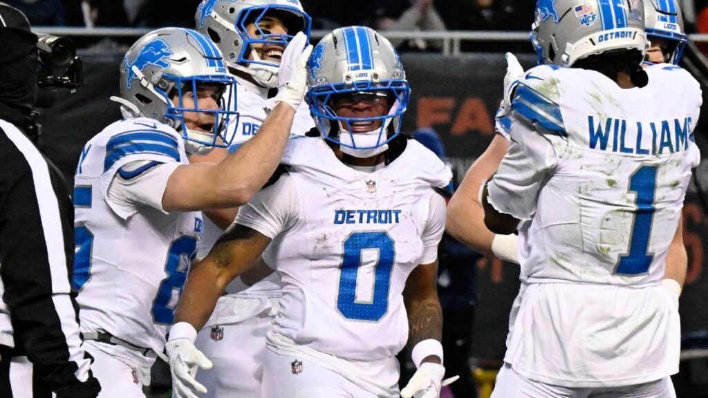 Detroit Lions running back Jahmyr Gibbs (0) celebrates with teammates after scoring a touchdown against the Chicago Bears during the first half at Soldier Field.