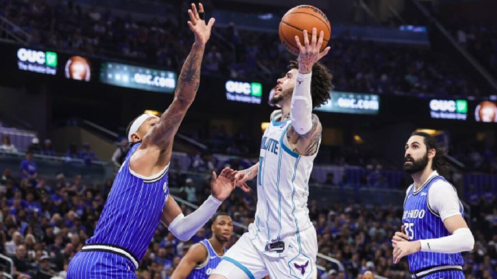 Charlotte Hornets guard LaMelo Ball (1) shoots against Orlando Magic forward Paolo Banchero (5) during the second half during the play-in rounds of the 2026 NBA Playoffs at Kia Center.
