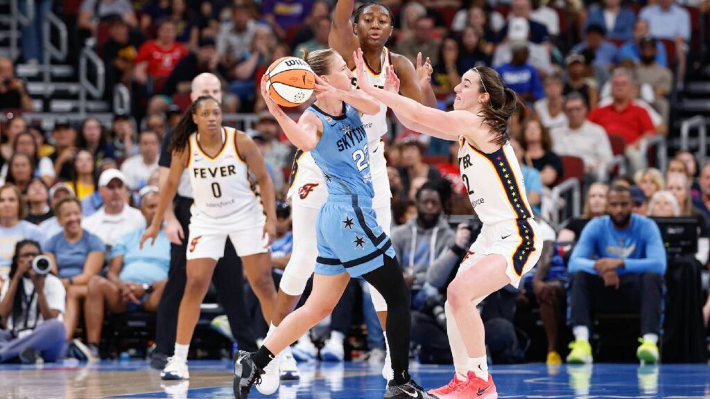 Indiana Fever guard Caitlin Clark (22) defends against Chicago Sky guard Courtney Vandersloot (22) during the first half at United Center.
