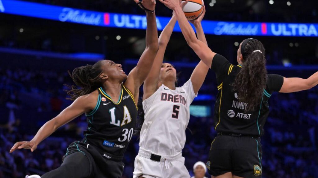 Los Angeles Sparks forward Nneka Ogwumike (30), Atlanta Dream forward Angel Reese (5) and Los Angeles Sparks forward Dearica Hamby (5) reach for a rebound in the second half at Crypto.com Arena. 