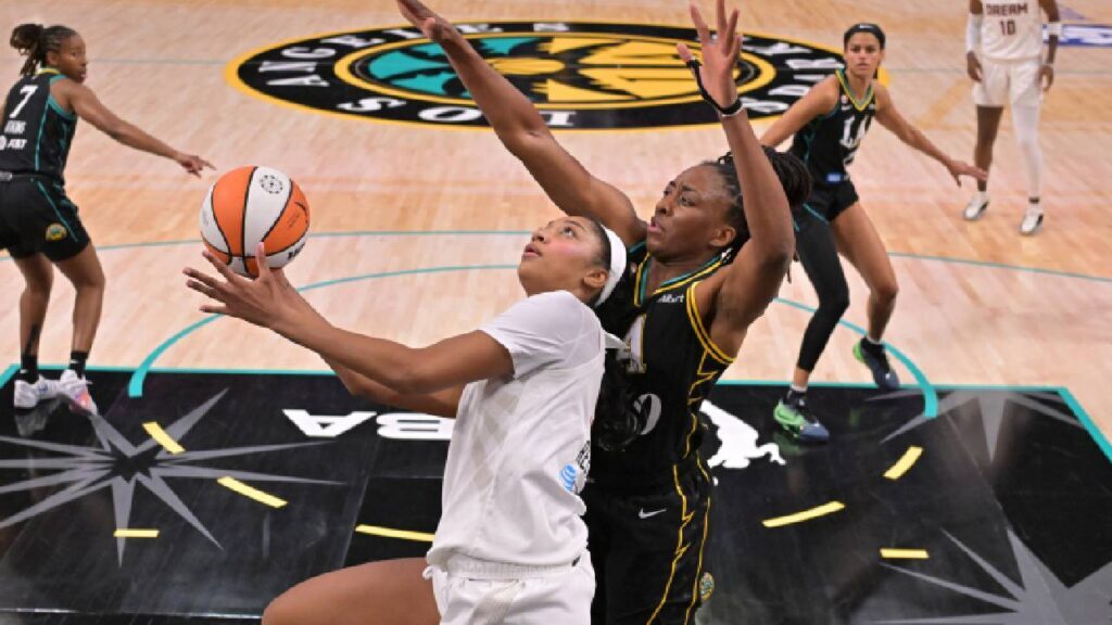 Atlanta Dream forward Angel Reese (5) is defended by Los Angeles Sparks forward Nneka Ogwumike (30) in the first half at Crypto.com Arena. 