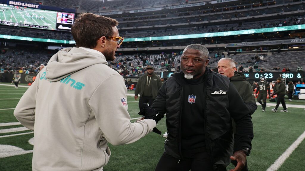 NFL coaches' hot seat candidate Aaron Glenn with Mike McDaniel after the game at MetLife Stadium.