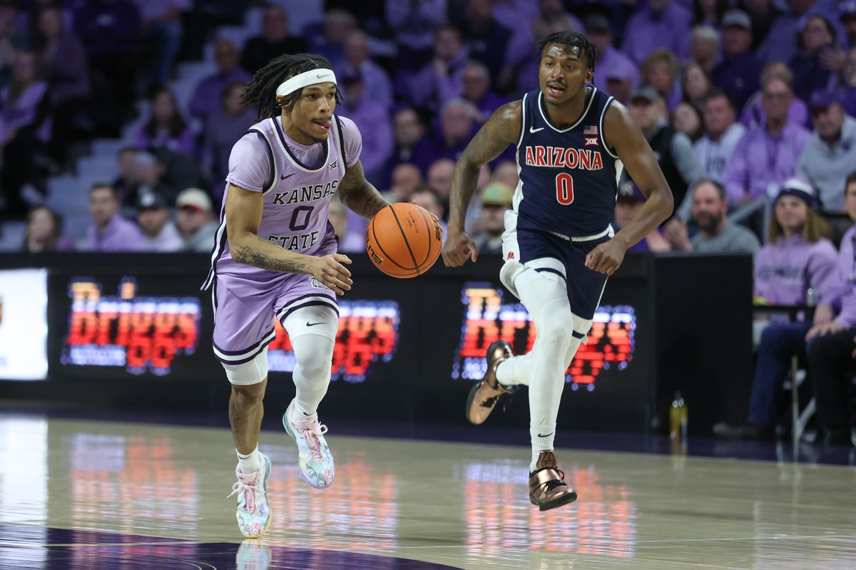 kansas state player dribbles past AZ player