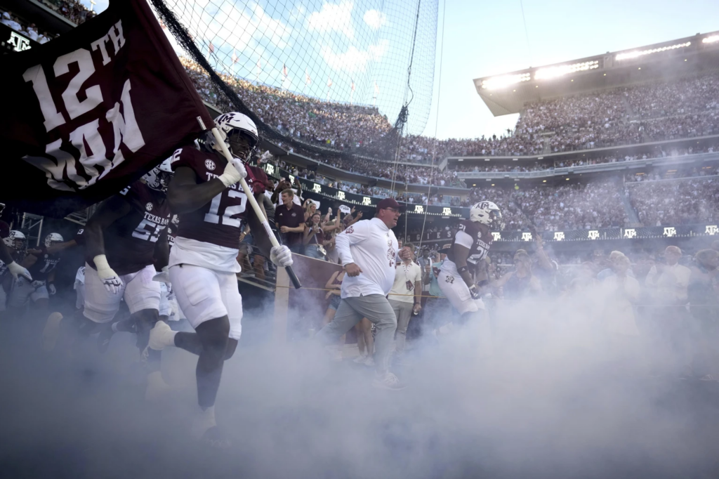 Texas A&M head coach Mike Elko leads the Aggies on to Kyle Field for the first time on Saturday, Aug. 31, 2024, in College Station, Texas.
