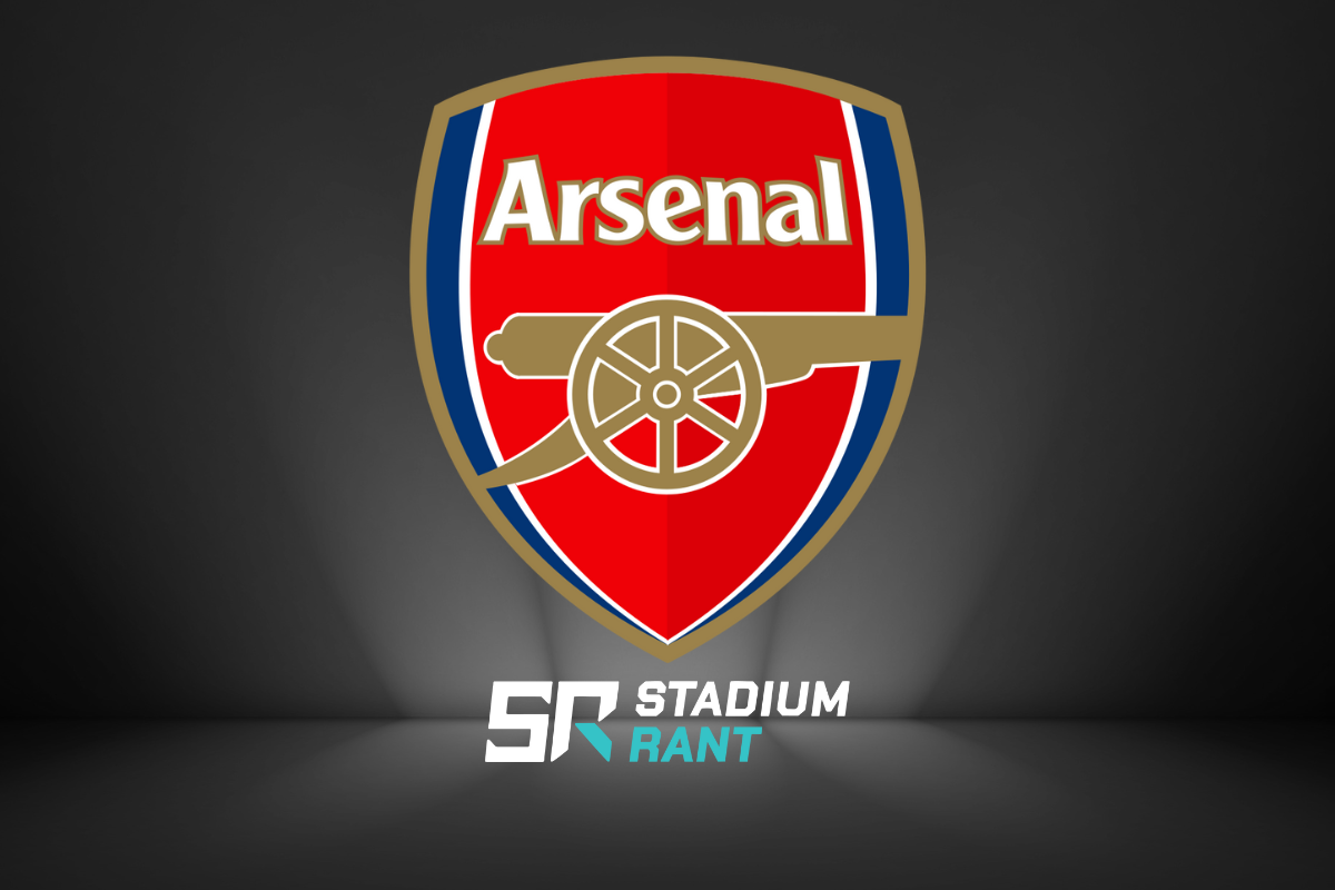 Arsenal's Double-Winning Football Club crest featuring a gold cannon on a red shield with gold and blue outlines. The word "Arsenal" is written above the cannon in white letters with a gold outline. Below the crest, the Stadium Rant logo is displayed on a dark background.