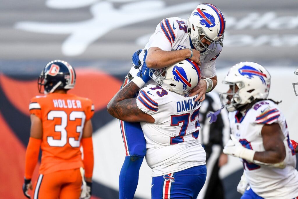 Buffalo Bills lineman Dion Dawkins celebrating with Josh Allen