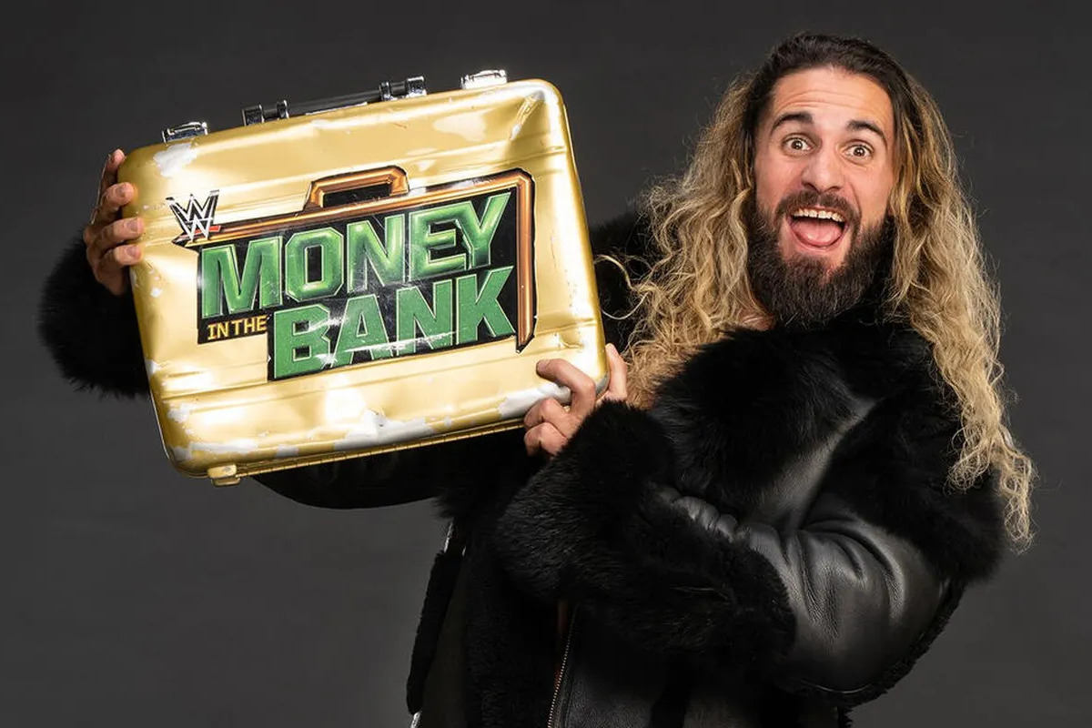 Seth Rollins poses with Money in the Bank briefcase