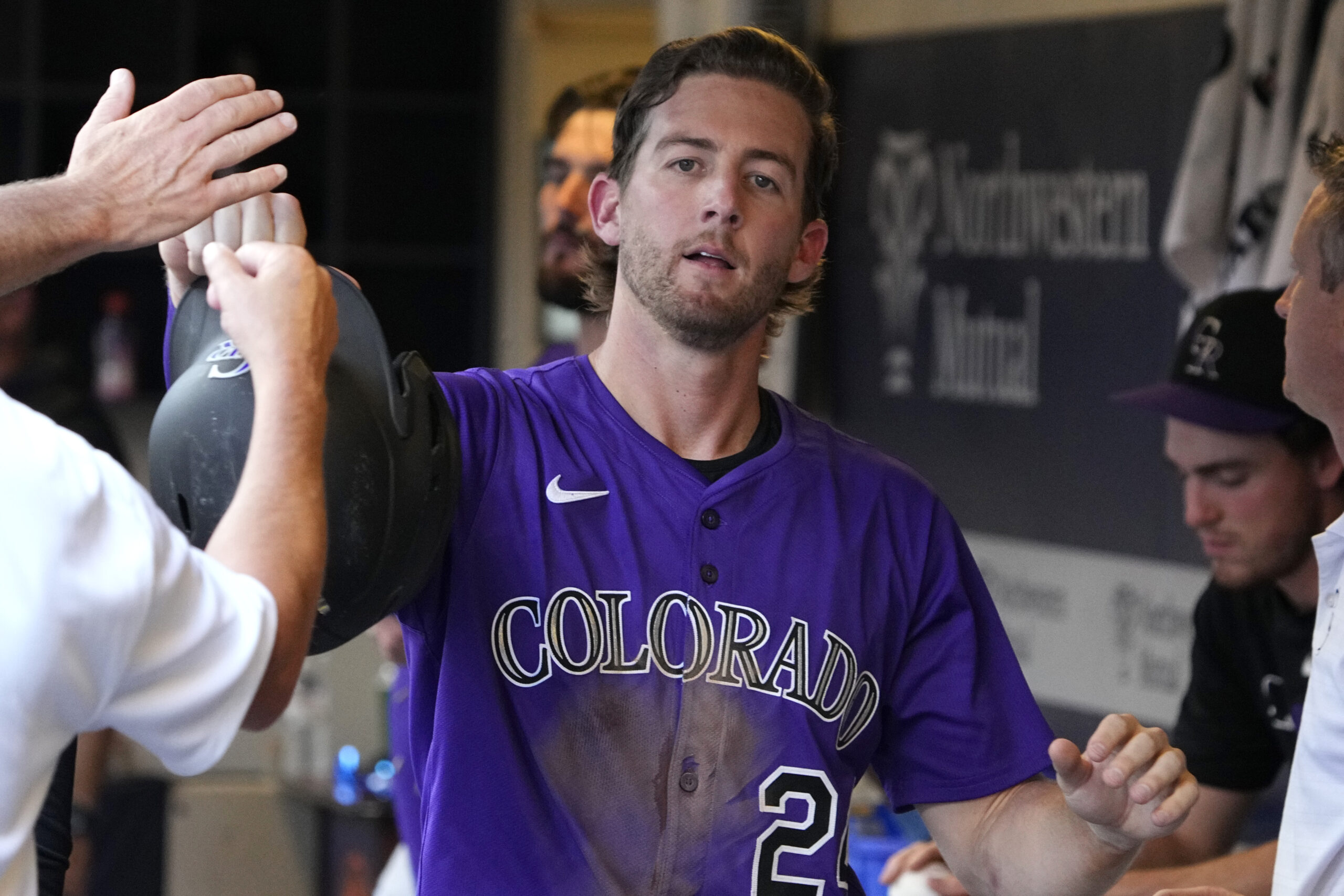 Jun 29, 2025; Milwaukee, Wisconsin, USA; Colorado Rockies third base Ryan McMahon (24) celebrates after scoring a run against the Milwaukee Brewers in the eighth inning at American Family Field. Mandatory Credit: Michael McLoone-Imagn Images