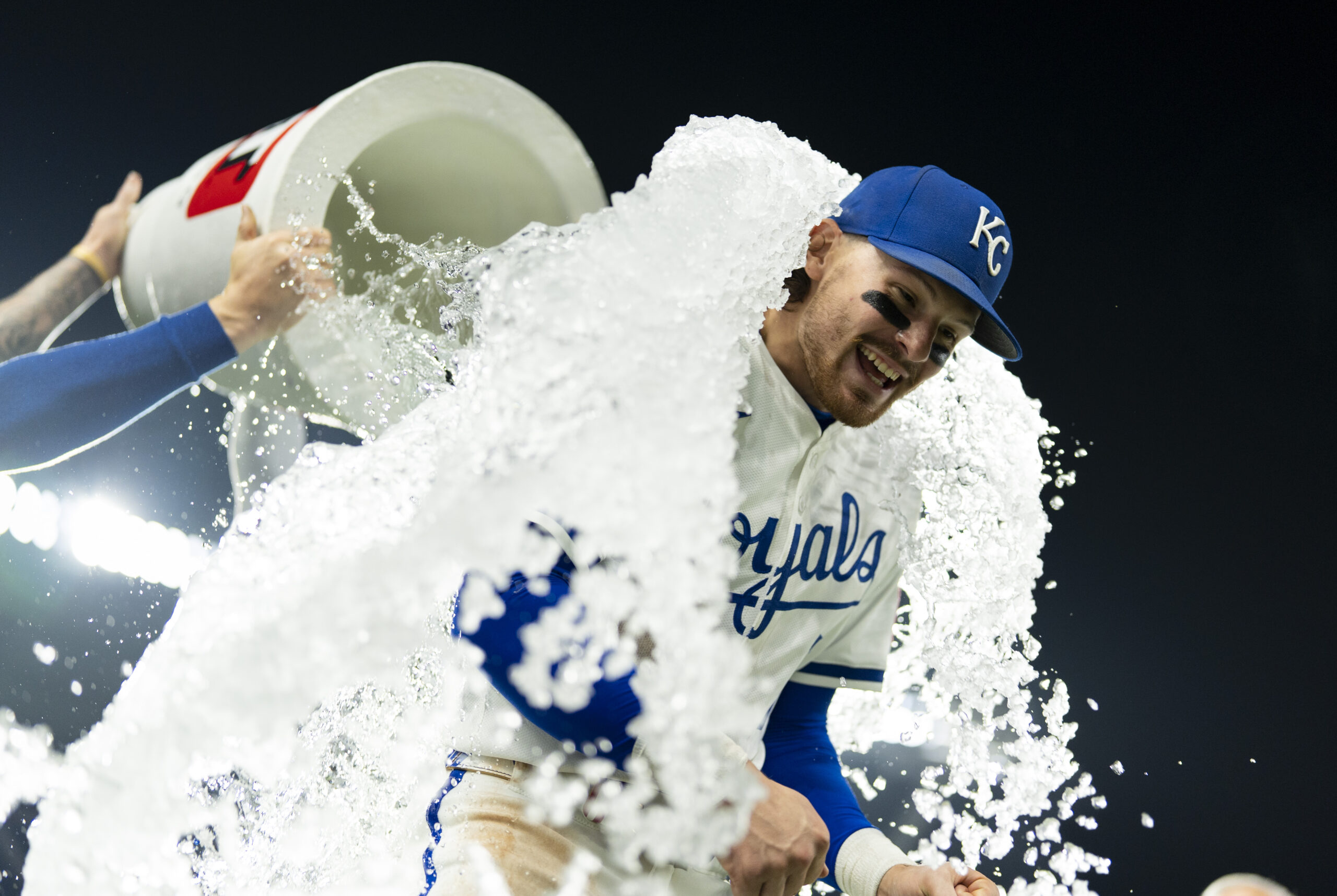 Sep 4, 2025; Kansas City, Missouri, USA; Kansas City Royals shortstop Bobby Witt Jr. (7) is doused by center fielder Kyle Isbel (28) and second baseman Tyler Tolbert (2) after defeating the Los Angeles Angels at Kauffman Stadium. Mandatory Credit: Jay Biggerstaff-Imagn Images