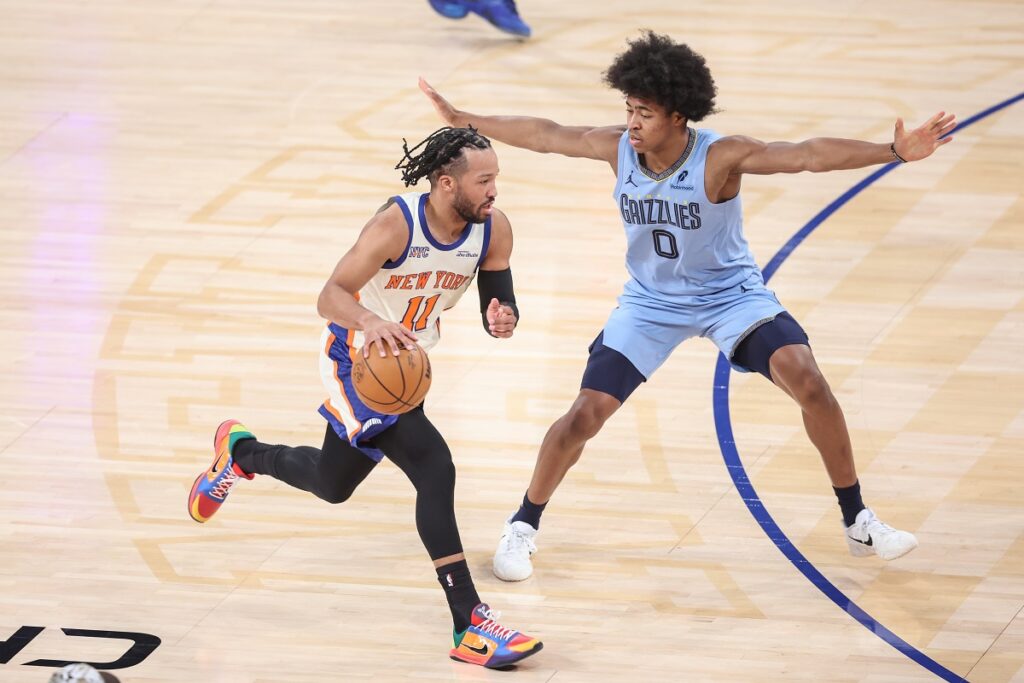 New York Knicks guard Jalen Brunson (11) looks to drive past Memphis Grizzlies forward Jaylen Wells (0) in the first quarter at Madison Square Garden.