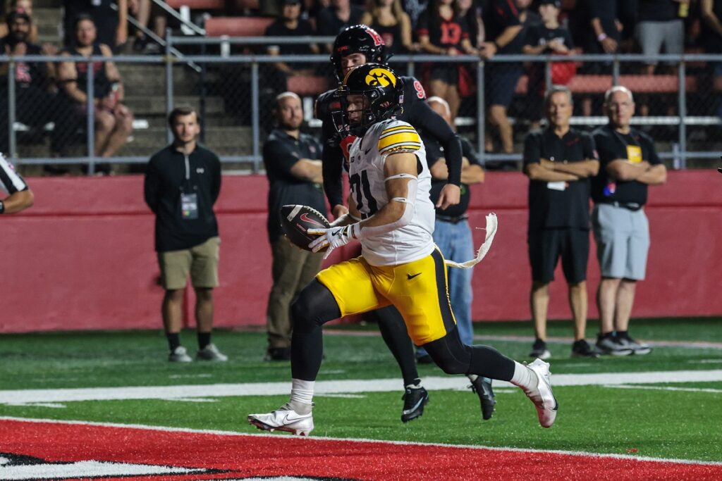 Iowa Hawkeyes wide receiver Kaden Wetjen (21) returns the opening kickoff for a touchdown during the first quarter against the Rutgers Scarlet Knights at SHI Stadium.
