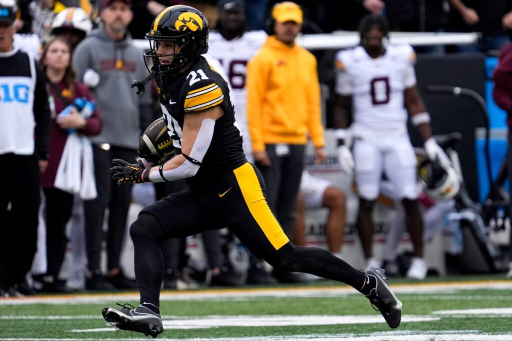 Iowa Hawkeyes wide receiver Kaden Wetjen (21) runs a punt return back scoring a touchdown against the Minnesota Golden Gophers Oct. 25, 2025, at Kinnick Stadium in Iowa City, Iowa.