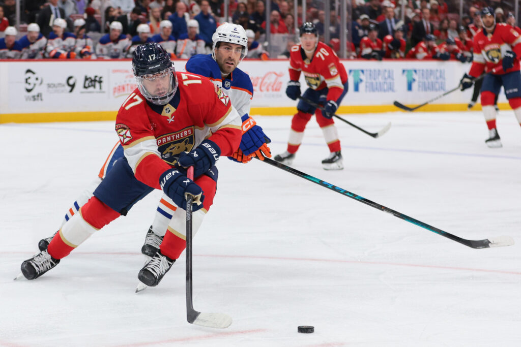 Evan Rodrigues attempts to keep the puck away from Evan Bouchard during Saturday's 2025 Stanley Cup Final rematch.