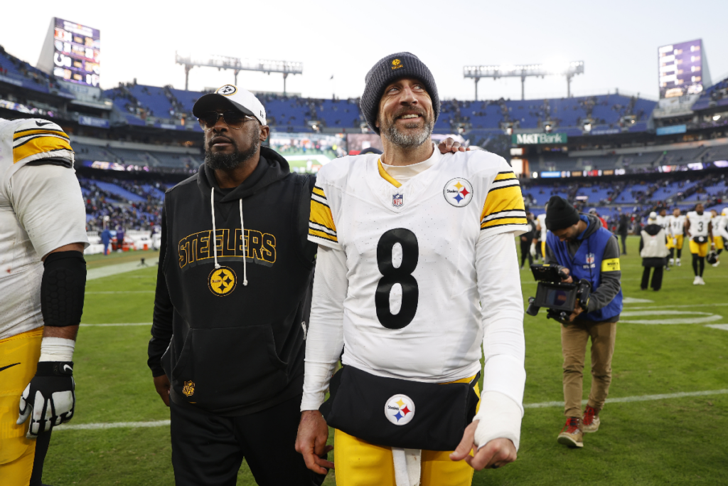 Dec 7, 2025; Baltimore, Maryland, USA; Pittsburgh Steelers head coach Mike Tomlin and quarterback Aaron Rodgers (8) walk off the field after the game against the Baltimore Ravens at M&T Bank Stadium. Mandatory Credit: Peter Casey-Imagn Images