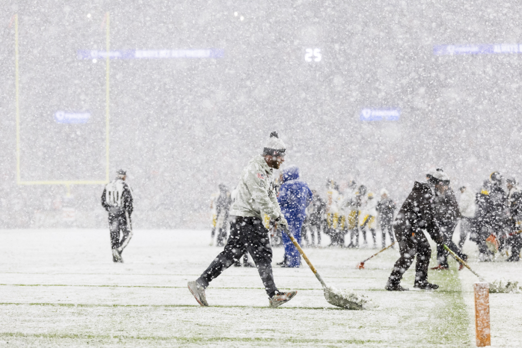 Nov 21, 2024; Cleveland, Ohio, USA; Grounds crew members shovels snow off the yard lines during the third quarter between the Cleveland Browns and the Pittsburgh Steelers at Huntington Bank Field Stadium. Mandatory Credit: Scott Galvin-Imagn Images
