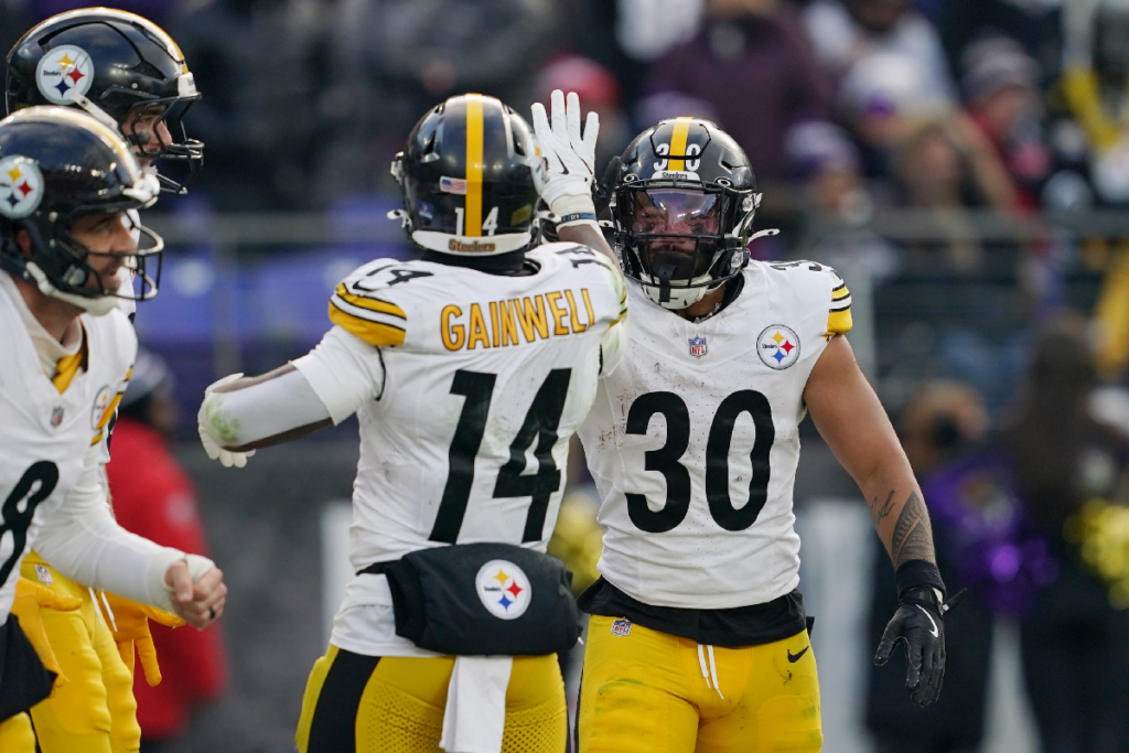 Dec 7, 2025; Baltimore, Maryland, USA; Pittsburgh Steelers running back Jaylen Warren (30) is congratulated by running back Kenneth Gainwell (14) after scoring a touchdown against the Baltimore Ravens during the second half at M&T Bank Stadium. Mandatory Credit: Mitch Stringer-Imagn Images
