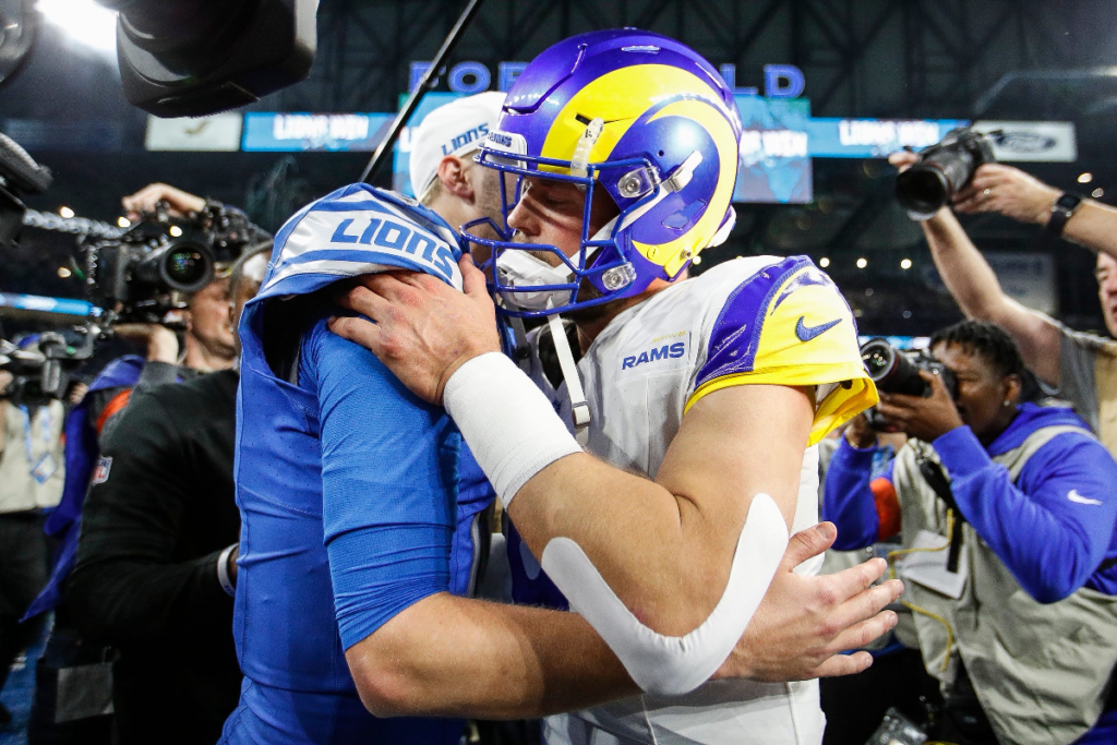 Detroit Lions quarterback Jared Goff hugs Los Angeles Rams quarterback Matthew Stafford after the Lions' 24-23 win in the NFC wild-card game at Ford Field in Detroit on Sunday, Jan, 14, 2024