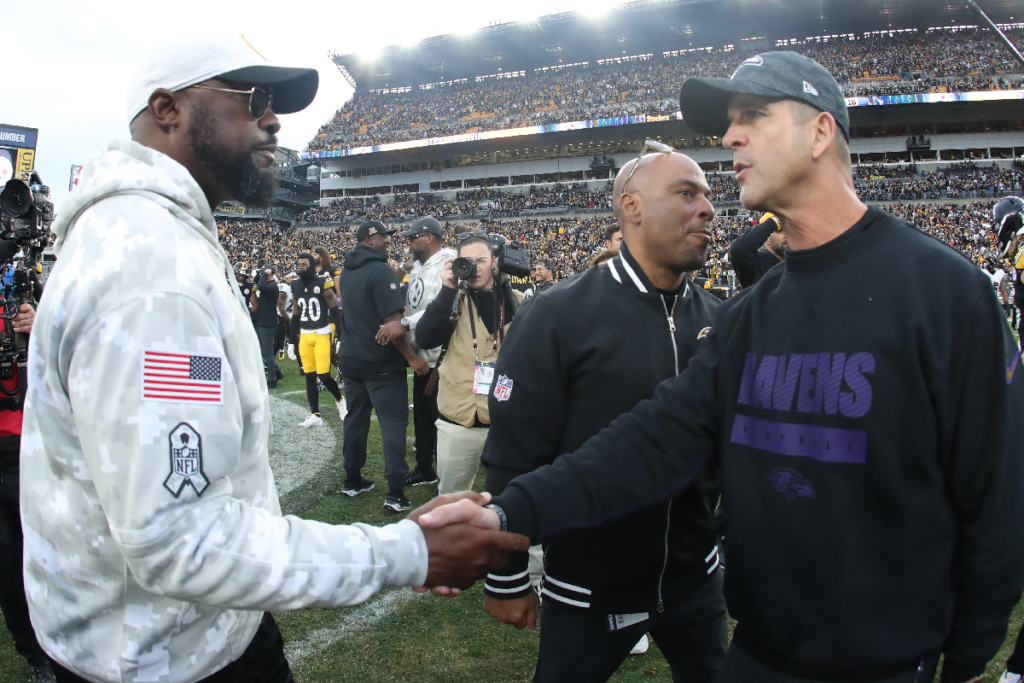 Nov 17, 2024; Pittsburgh, Pennsylvania, USA; Pittsburgh Steelers head coach Mike Tomlin (left) and Baltimore Ravens head coach John Harbaugh (right) shake hands after the game at Acrisure Stadium. Mandatory Credit: Charles LeClaire-Imagn Images
