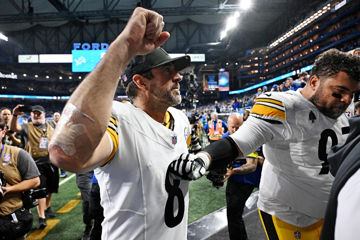 Steelers quarterback Aaron Rodgers basks in glory as he walks off Ford Field after a massive victory against the Lions