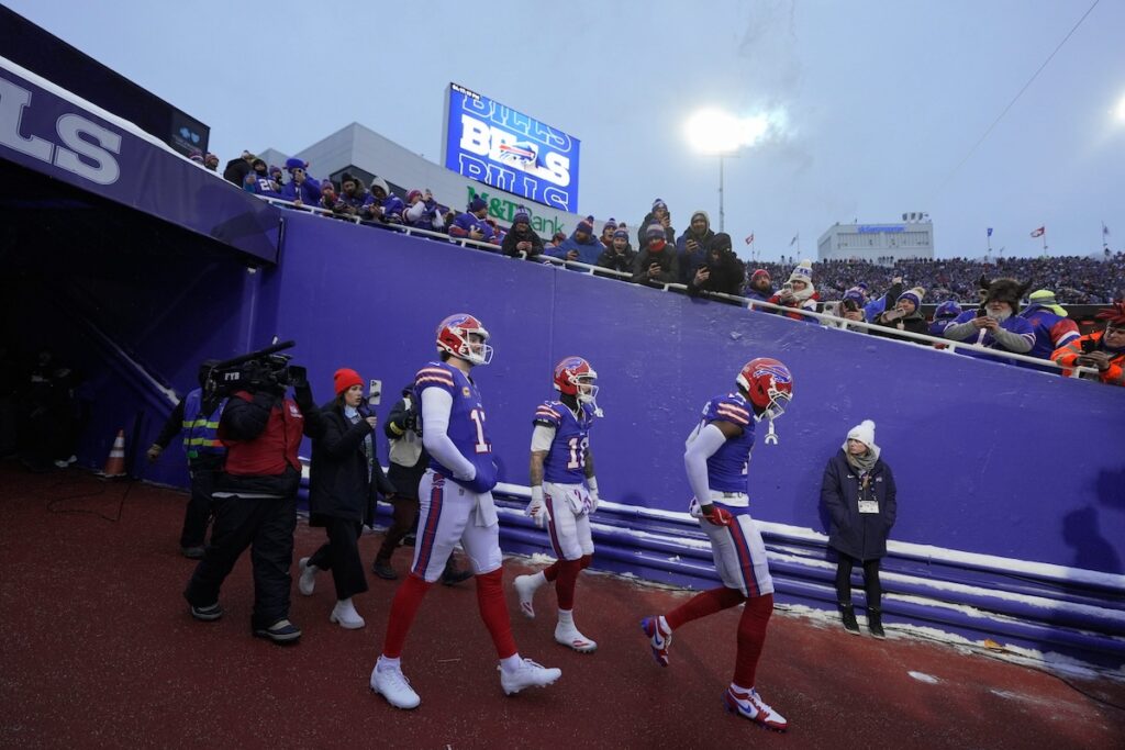 Buffalo Bills' players marching onto the field for the last game at Highmark Stadium