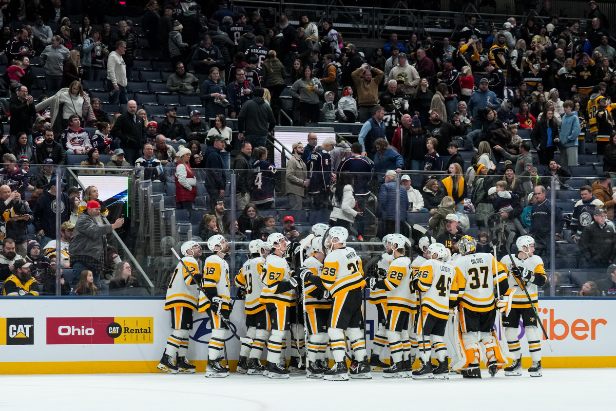 The Pittsburgh Penguins celebrate a win on the road.
