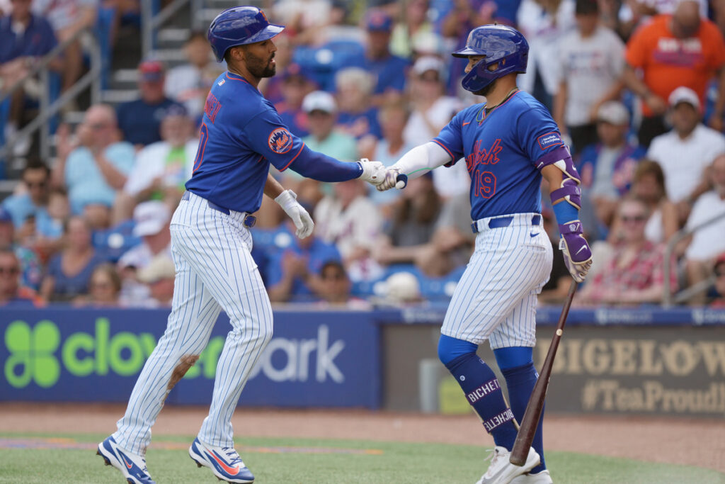 Marcus Semien is congratulated by Bo Bichette after hitting a home run for the Mets. 