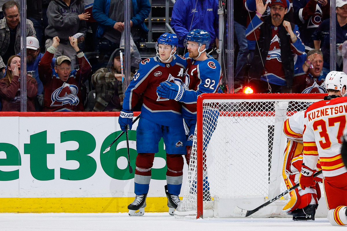 Colorado Avalanche players celebrate a goal.