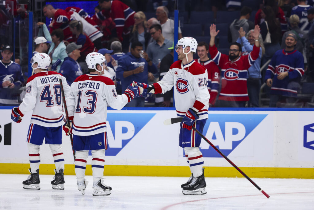 Canadiens players celebrate winning Game 1.