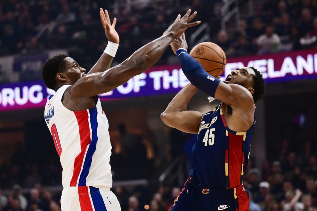 Detroit Pistons center Jalen Duren defends Donovan Mitchell's drive in the first quarter of game six.