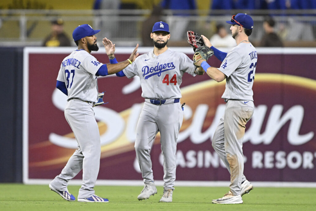 Dodgers outfielders celebrate. 