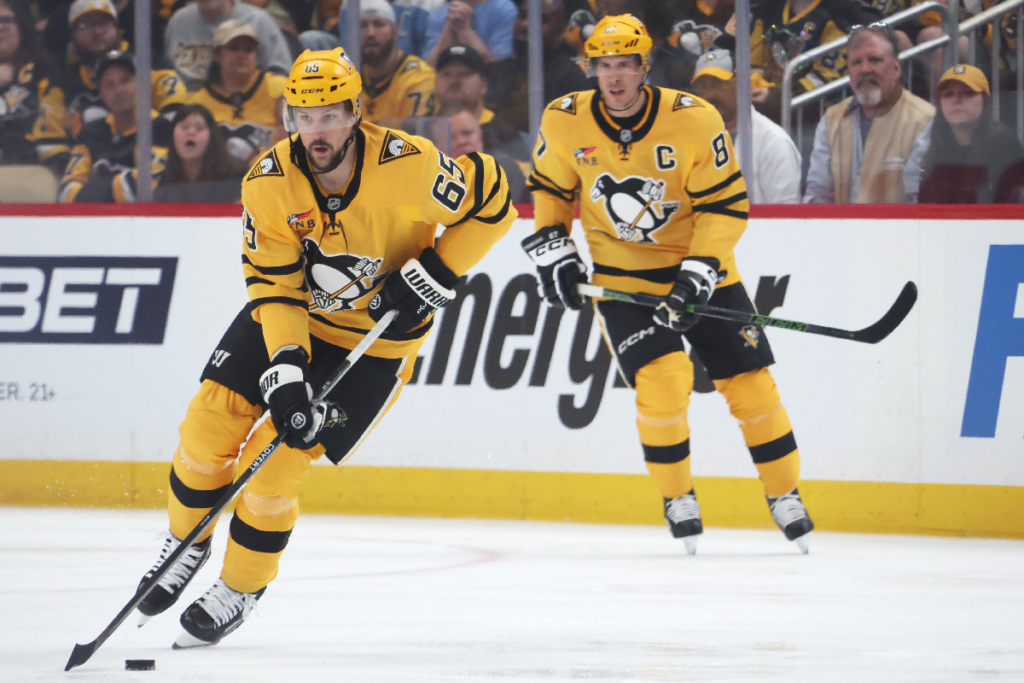 Apr 18, 2026; Pittsburgh, Pennsylvania, USA; Pittsburgh Penguins defenseman Erik Karlsson (65) skates up ice with the puck against the Philadelphia Flyers during the first period in game one of the first round of the 2026 Stanley Cup Playoffs at PPG Paints Arena. Mandatory Credit: Charles LeClaire-Imagn Images