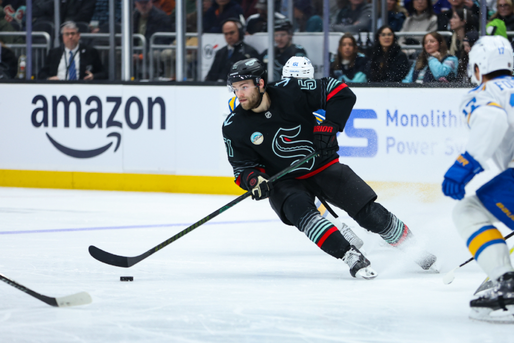 Mar 4, 2026; Seattle, Washington, USA; Seattle Kraken center Shane Wright (51) moves the puck in the second period against the St. Louis Blues at Climate Pledge Arena. Mandatory Credit: Kevin Ng-Imagn Images