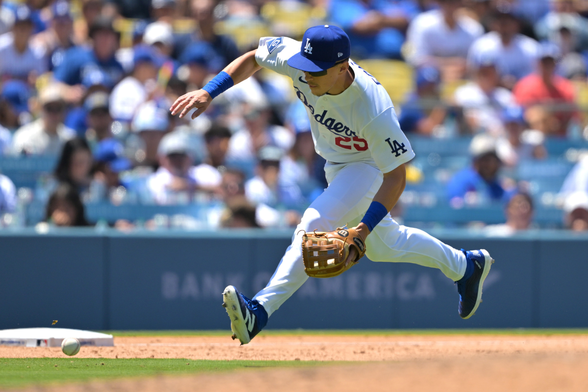 Jun 17, 2026; Los Angeles, California, USA; Los Angeles Dodgers third baseman Tommy Edman (25) makes a play in the eighth inning against the Tampa Bay Rays at Dodger Stadium. Mandatory Credit: Jayne Kamin-Oncea-Imagn Images