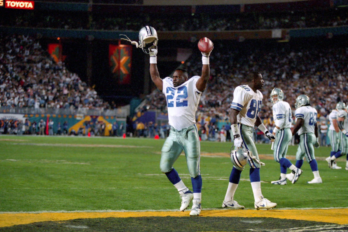 Jan 28, 1996; Tempe, AZ, USA; Dallas Cowboys running back, number one in all time rushing leaders, Emmitt Smith celebrates after scoring a touchdown during Super Bowl XXX against the Pittsburgh Steelers at Sun Devil Stadium. The Cowboys won the game 27-17. Mandatory Credit: Photo by USA TODAY Sports Copyright 1996 USA TODAY Sports