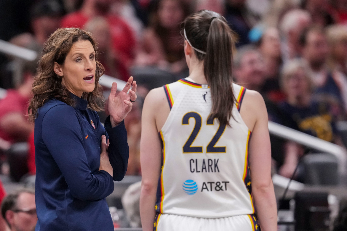 Indiana Fever head coach Stephanie White talks with Indiana Fever guard Caitlin Clark (22) on Wednesday, June 24, 2026, during the first half of a game at Gainbridge Fieldhouse in Indianapolis. The Phoenix Mercury defeated the Indiana Fever, 111-109.