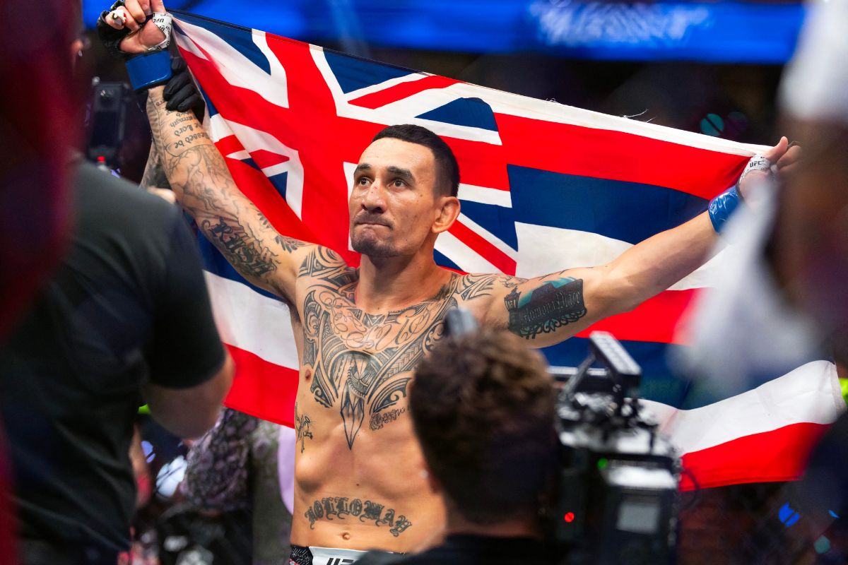 Max Holloway celebrating in the UFC octagon