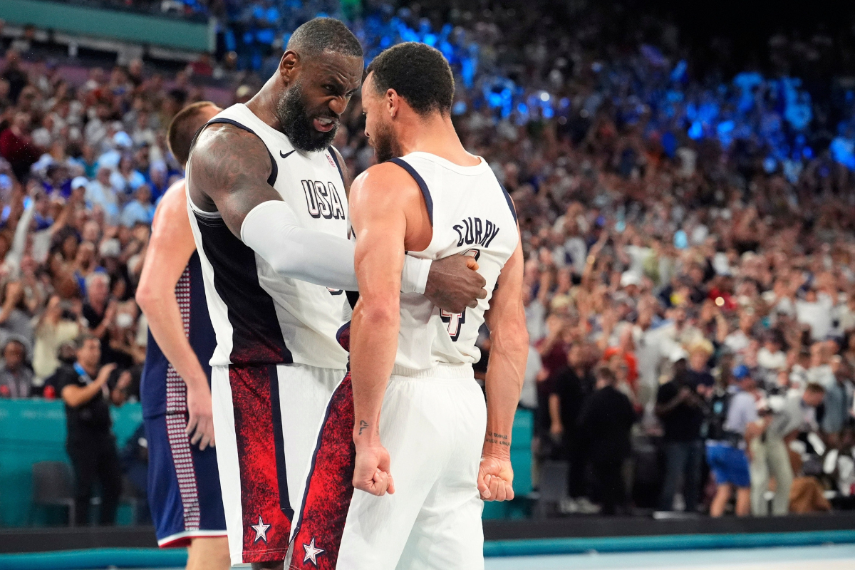 United States forward LeBron James and guard Stephen Curry of the Warriors celebrate after the game against Serbia in a men's basketball semifinal during the Paris 2024 Olympic Summer Games at Accor Arena on Aug. 8, 2024.