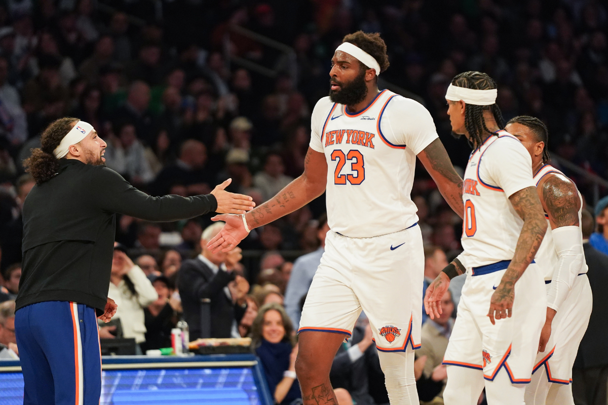 Apr 9, 2026; New York, New York, USA; New York Knicks guard Jose Alvarado (5) high fives New York Knicks center Mitchell Robinson (23) during a timeout in the first half against the Boston Celtics at Madison Square Garden. Mandatory Credit: Lucas Boland-Imagn Images