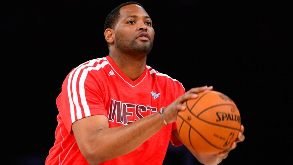 NBA former player Robert Horry shoots during the 2013 NBA All-Star shooting stars competition at the Toyota Center.