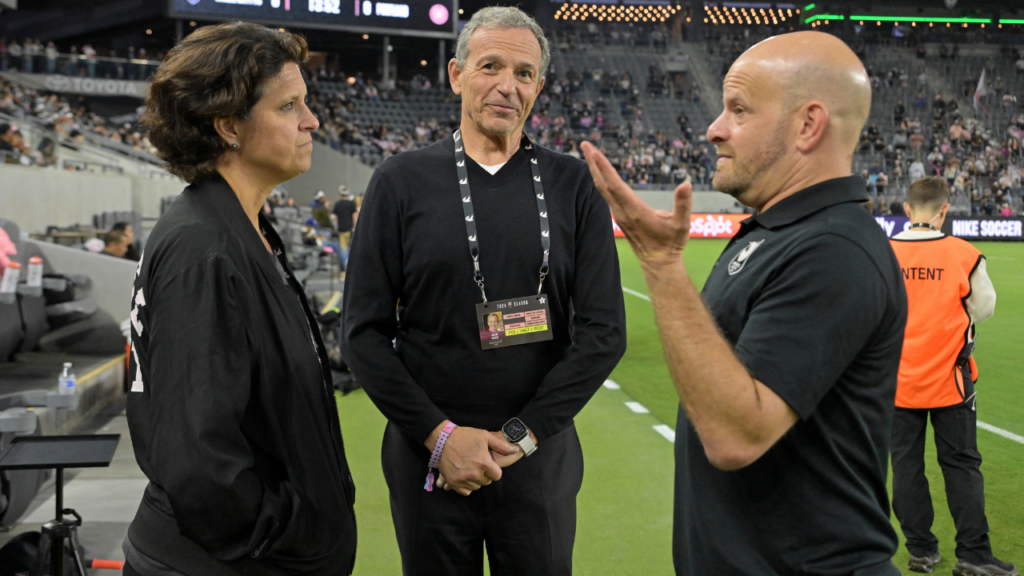Sep 23, 2024; Los Angeles, California, USA; Angel City FC president Julie Uhrman (left) talks with Disney chief executive officer Bob Iger (center) and Ben Grossman before the game at BMO Stadium. Mandatory Credit: Jayne Kamin-Oncea-Imagn Images. Kushner. 