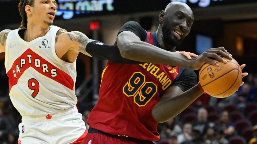 Toronto Raptors forward D.J. Wilson (9) and Cleveland Cavaliers center Tacko Fall (99) reach for a rebound in the fourth quarter at Rocket Mortgage FieldHouse.