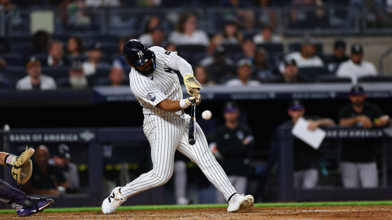 Sep 8, 2026; Bronx, New York, USA; New York Yankees outfielder Cody Bellinger (35) hits a double during the eighth inning against the Colorado Rockies at Yankee Stadium. Mandatory Credit: Vincent Carchietta-Imagn Images